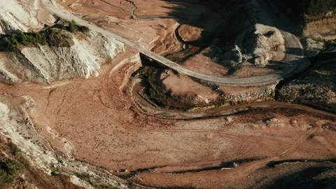 Video of drone views of a mountain landscape with a river crossing a bridge Stock Footage 233820751