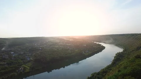 Video from the drone where river bend merges with the sunset. Stock Footage 128278474