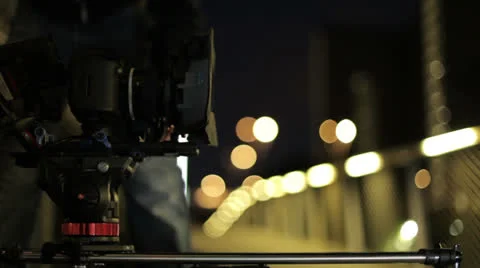 Video dslr camera advancing on slider with beatiful lights in bg Stock Footage 25732403