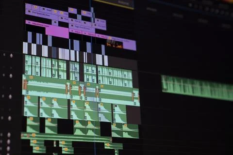 Video editing timeline showcasing multiple tracks and adjustments in a digi.. Stock Photos