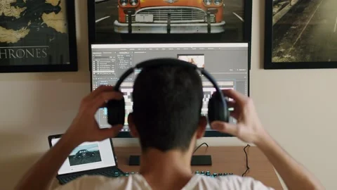 Video editor and programmer working on his computer and tablet Stock Footage 140144018