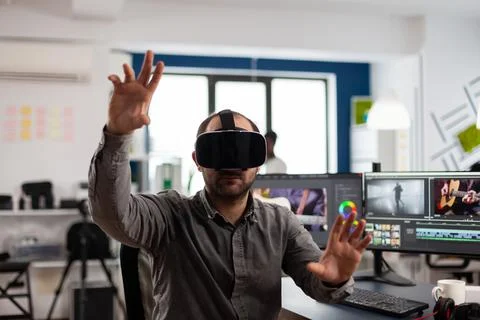 Video editor experiencing virtual reality headset Stock Photos