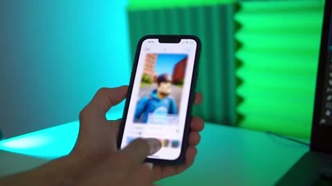 The video editor program on the phone. A young man is editing a video Stock Footage 242723027