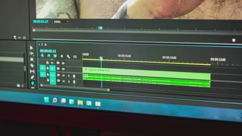 Video editor scrubbing through audio track on computer Stock Footage 295191016