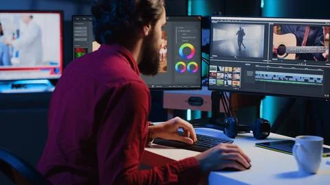 Video editor selecting key frames for video montage, using specialized software Fotos de archivo