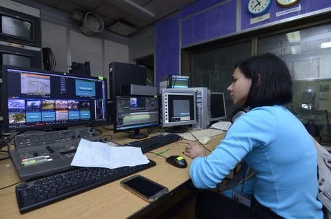 Video editor working with professional broadcasting equipment and audio mixer Stock Photos