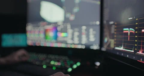 Video Editor Working Remotely from Home Color Correcting Footage at Night. Stock Footage 234584811
