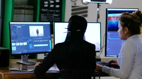 Video Editors at Work in Editing Stock Footage 151016038