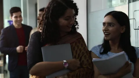 Video of Employees walking and talking while going in a meeting in the hallway Stock Footage 244123643