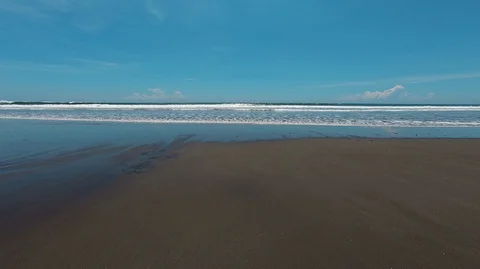 Video of empty sandy beach with sea waves Stock Footage