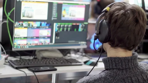 Video engineer in the process of working at his computer. Stock Footage 234552359