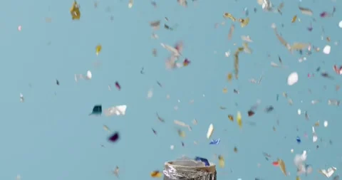 Video of exploding party popper and falling confetti on blue background Video stock 331245845