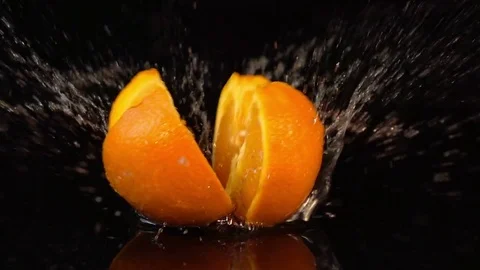 Video of falling quarter of orange in real slow motion Stock Footage 79089073