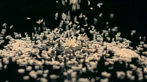 Video of falling rice in real slow motion Stock Footage 79289779