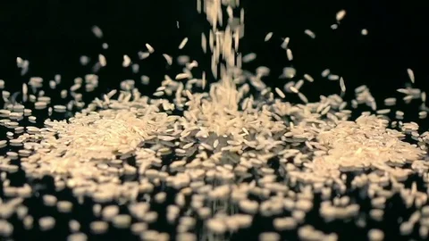 Video of falling rice in real slow motion Stock Footage 79300121