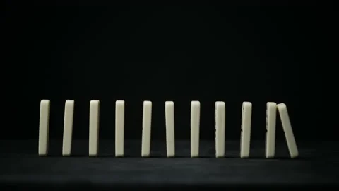 Video of falling sideways elements of the game of dominoes Stock Footage 153748536