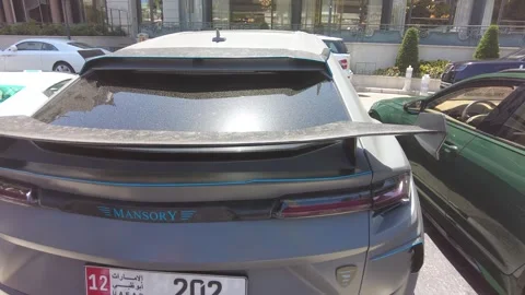 This video features a Mansory Lamborghini Urus parked in front of the Hotel de Stock Footage 280931788