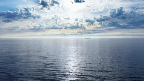 A video featuring a vast body of water with a  stretching across the horizon Stock Footage 337349680