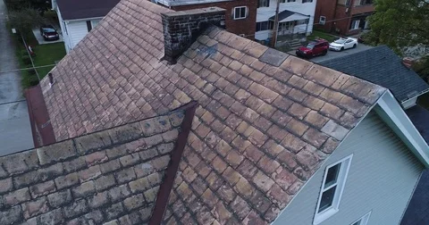 Video Feed of Drone Inspecting Damaged Slate Roof Stock Footage 80070796