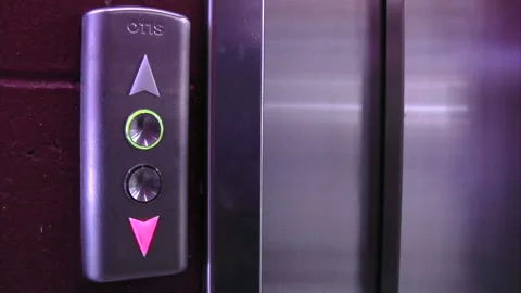 Video of a female calling the elevator in trading center Stock Footage 233464886