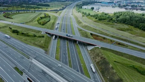 Video filming from a drone, view of the road junction with cars moving along it Stock Footage 171011337