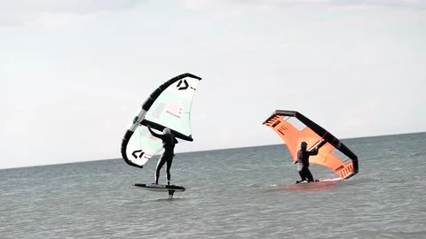 Video of fit athlete practise hydro foil wing surfing  Stock Footage 247367840