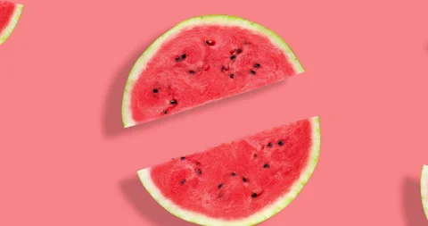 Video of flat lay of watermelon half slices on pink background. Watermelon Stock Footage 269974333