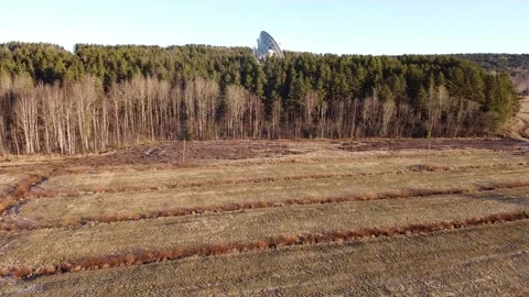 A video of the flight to the telescope through a field in early spring Stock Footage 130435325