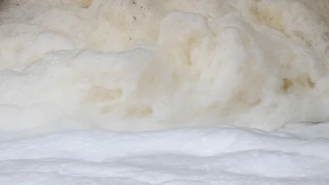 In this video, foam producing a waterfall, with visible dirt. Stock Footage 263922012