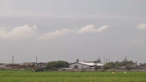 Video footage of a Cloud Timelapse industry in the village area Stock Footage 103467784
