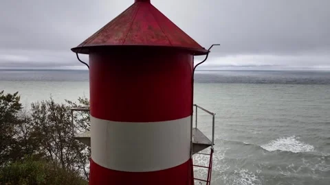 Video footage of a lighthouse serving as a beacon on the edge of the cliff. Stock Footage 255807498