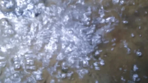 Video of a fountain in a fish pond that makes bubbles Stock Footage 232719853