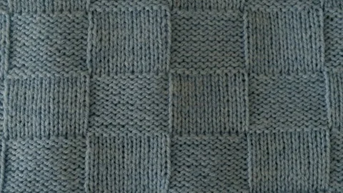 Video of fragment of knitted sweater with pattern. Stock Footage 257069448