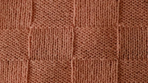Video of fragment of knitted sweater with pattern. Stock-Footage 257069631