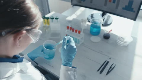Video fragment presents the work of scientists in a chemical laboratory, where Stock Footage 240320252