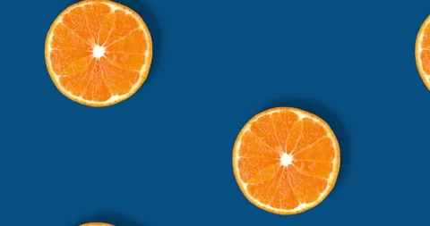 Video of fruit pattern of fresh citrus slices isolated on classic blue Stock Footage 267626688