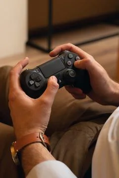 Video game console controller in gamer hands. Gaming joystick in hand Stock Photos