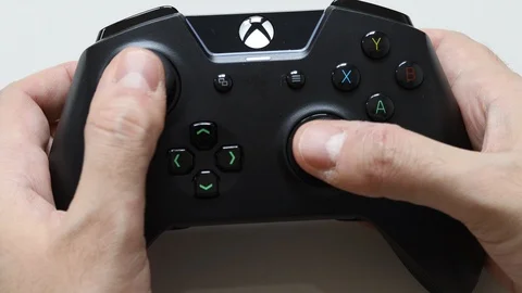 Video game control black hand playing buttons technology editorial Stock Footage 125420211
