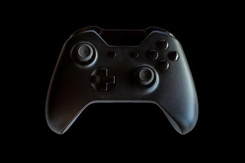 Video game controller and game controller. Black background. Selective focus Foto stock