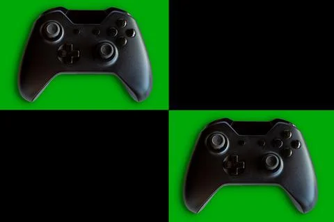 Video game controller and game controller. Black and green background. Select Stock Photos