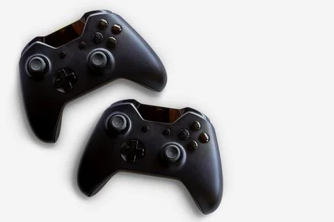 Video game controller and game controller. White background. Selective focus. Stock Photos