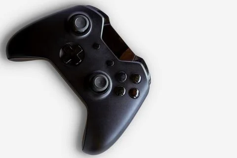 Video game controller and game controller. White background. Selective focus. Stock Photos