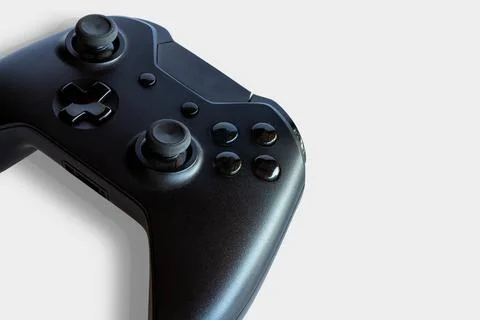 Video game controller and game controller. White background. Selective focus. Stock Photos
