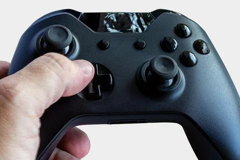 Video game controller and game controller. White background. Selective focus. Stock Photos