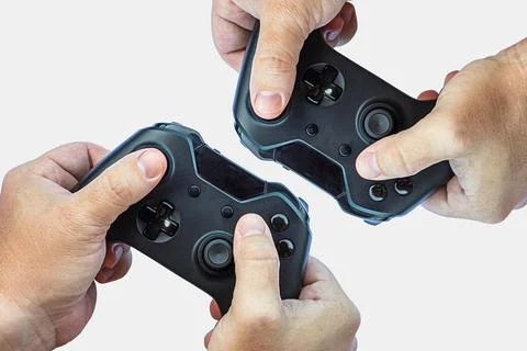 Video game controller and game controller. White background. Selective focus. Stock Photos