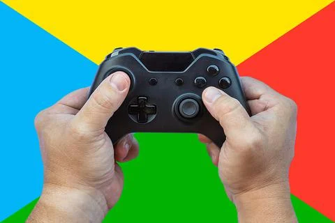 Video game controller and game controller. Colored background. Selective focu Stock-Fotos