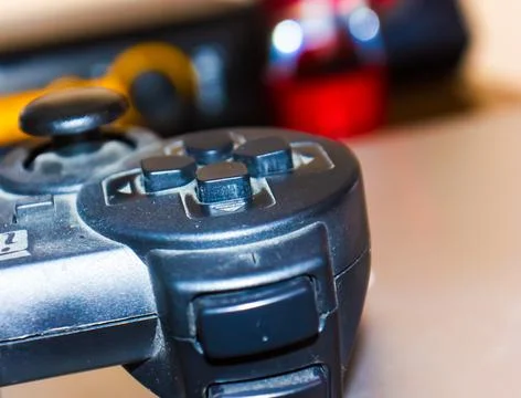 Video game controller on blurred background Stock Photos