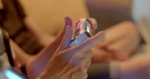 Video game controller hands age woman clicks application control buttons Stock-Footage 202045201