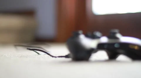 Video Game Controller Lying on Floor Stock Footage 49122453