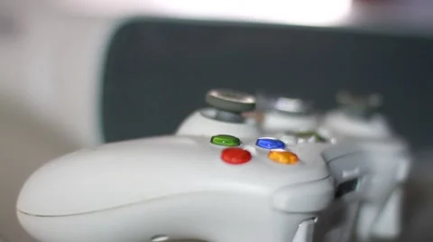 Video Game Controller Lying on Shelf Next to Console Stock Footage 49120972